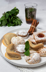 Traditional tea with mint and assorted Arab sweets