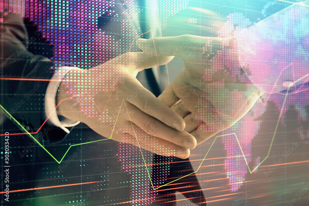 Poster multi exposure of forex graph and world map on abstract background with two businessmen handshake. c