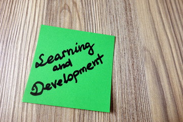 Handwriting of Learning and Development on sticky note