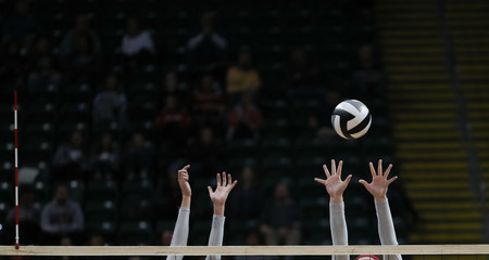 middle blockers during a volleyball match