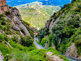 View atop the trainline platform above  Cathedral at Santa Maria de Montserrat abbey in Monistrol, Catalonia, Spain