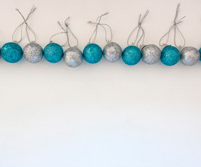 New year background with white and blue toys on white background