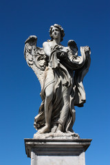Fototapeta na wymiar The statue of angel on the Rome's bridge