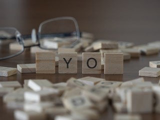 The concept of yo represented by wooden letter tiles
