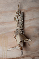 Corn, dry cob on wood