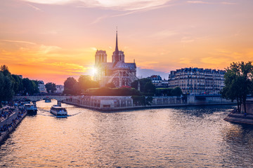 Fototapeta premium Notre Dame de Paris cathedral, France. Notre Dame de Paris Cathedral, most beautiful Cathedral in Paris. Picturesque sunset over Cathedral of Notre Dame de Paris, destroyed in a fire in 2019, Paris.