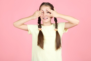 Beautiful young girl on pink background