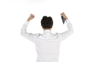 Portrait of back of smart young asian businessman holding computer tablet and Lift up the fist to celebrate on isolated white background. Image for business, technology and work concept.