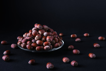 Hazelnut isolated on black background. Set or collection.