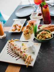 restaurant, food, people, date and holiday concept - close up sushi plate at restaurant