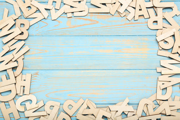 Wooden letters on blue table