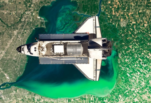 Space shuttle take off in the space from Earth. Stars and Planet on background. Atmosphere. Elements of this image furnished by NASA