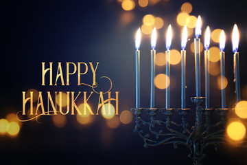 Religion image of jewish holiday Hanukkah background with menorah (traditional candelabra) and...