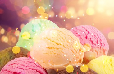 Chocolate, vanilla and strawberry ice cream in the cones on blurred background