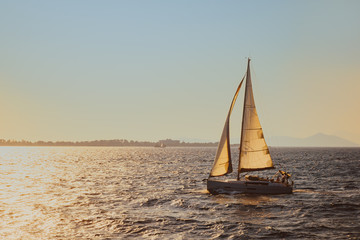 Fototapeta premium Yacht in the sea at sunset in Mediterranean sea, Turkey