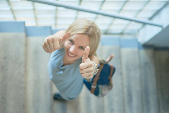 woman climbing stairs indoors