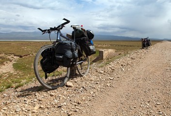 Unpaved road and two bicycles near Son-Kul lake