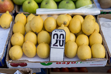 Lemons on a counter for sale