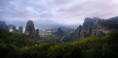 Panorama of Meteora mountains and monasteries at sunset