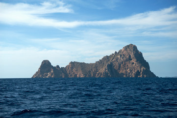 island of es vedra imposing rock massif seen from the sea