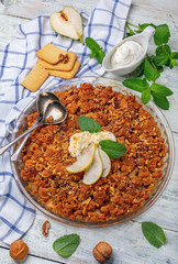 Pear crumble with a sprig of mint.