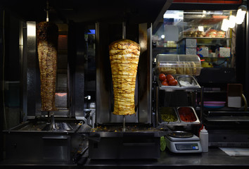 Grilled Turkish Doner Kebab on the street of Istanbul, Shawarma beef meat cooking on grill machine