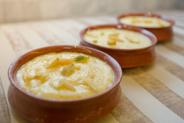 Nawabi food - Bowl of ferni created by milk and best quality rice.