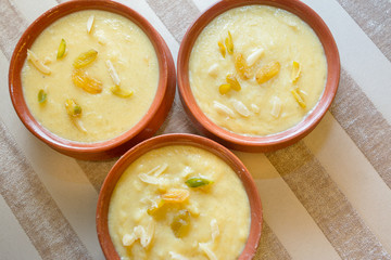 Nawabi food - Bowl of ferni created by milk and best quality rice.