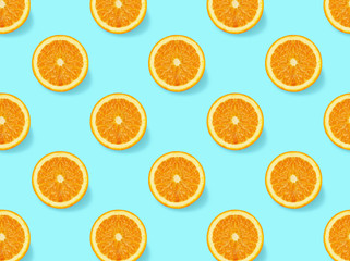 Fresh oranges on a blue background.