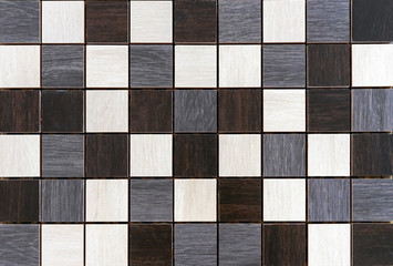 Ceramic mosaic tiles with brown, gray and white squares.