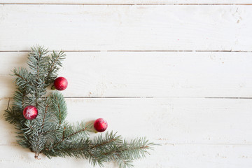 Christmas background fir tree and christmas decorations on wooden table with copy space. Top view