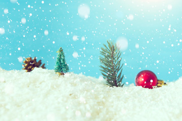 Fototapeta na wymiar Christmas holiday Baubles on snow over fir-tree. Macro