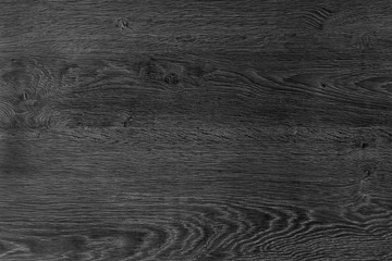 Obraz premium Black wood background. The texture of natural wood is dark color, flooring. The design board.