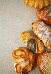 fresh sweet bun assortment on wooden surface