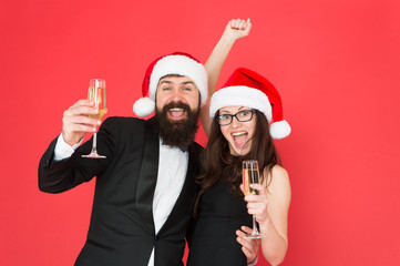 Giving Christmas toast. Happy family celebrate new year and Christmas. Couple in love with santa look party on Christmas eve. Merry christmas. Happy New Year