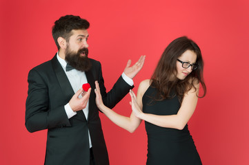 Break off wedding engagement. Bearded man give wedding ring to sensual woman. Couple in love in...
