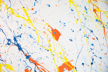 texture of multi-colored paint splashes on white background
