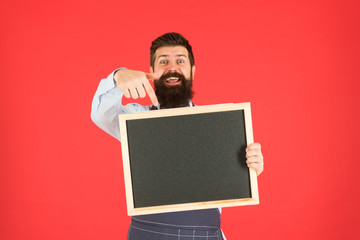 Call for delivery. mature man red background. happy hipster bartender. Restaurant menu. cafe shop advertisement. Happy hours. bearded man show chalkboard, copy space. brutal waiter in kitchen