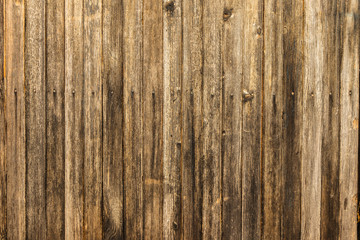 Naklejka premium Old gloomy planks nailed with rusty nails