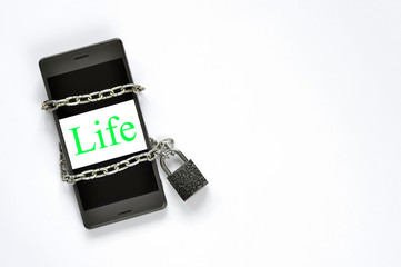 Mobile phone circuit of the castle on a white background. In an isolated white rectangle phone screen green lettering Life