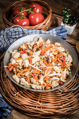 Fried chicken pieces with vegetables.