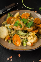 Fried chicken fillet with vegetables.