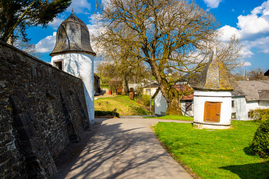 Castle Wallerode well tower and round tower of the revetment wall at the Belgian village of Wallerode