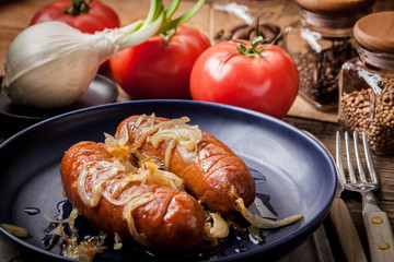 Fried sausage with onions.