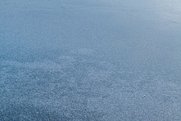 Fototapeta na wymiar Texture of ice covered with hoarfrost. Texture of surface covered with frost in winter.