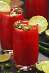Jalapeno tomato margarita cocktail with lime