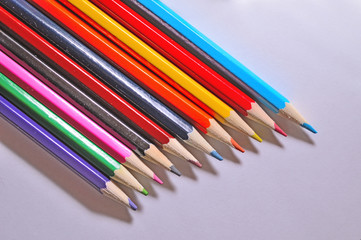 multicolored pencils on a light background