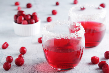 Glasses with red cranberry cocktail	