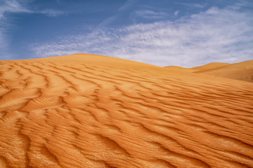 Red sand dunes with partly overcast sky, Moreeb dunes