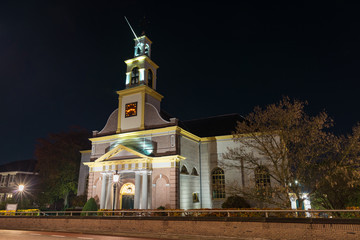 Naklejka premium Dutch protestant church is illuminated at night